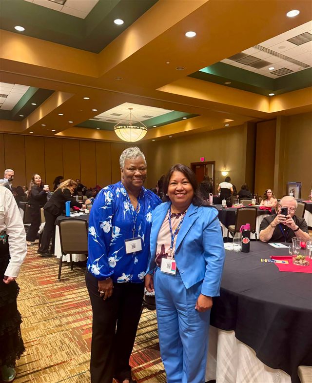 Connecting with an attendee at the New Mexico conference.
